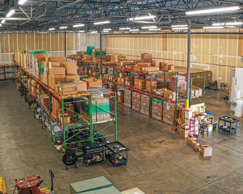 lots of boxes of spare parts stacked and organized in a warehouse